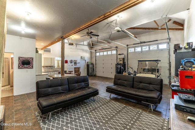4878 E Annapolis Ct, Coeur Dalene, ID 83814 - garage featuring water heater, ceiling fan, and a garage door opener