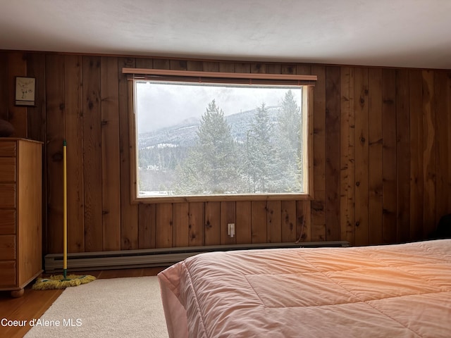 366 Yukon Rd, Bonners Ferry, ID 83805 - bedroom featuring multiple windows and wood walls