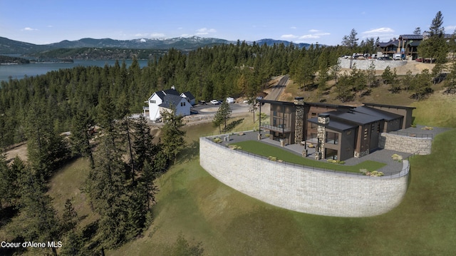 4663 E Plum Rd, Coeur Dalene, ID 83814 - aerial view of property's location with a forest and a water and mountain view