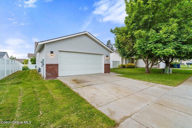 1374 W Timor Ave, Coeur Dalene, ID 83815 - view of front of house featuring brick siding, a garage, and driveway
