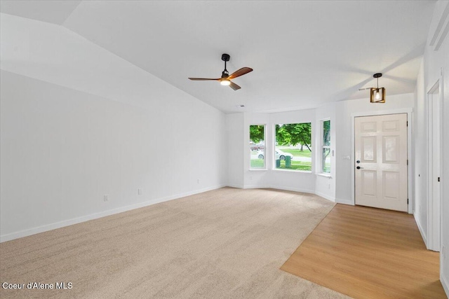 1374 W Timor Ave, Coeur Dalene, ID 83815 - foyer entrance featuring vaulted ceiling, a ceiling fan, baseboards, and light colored carpet