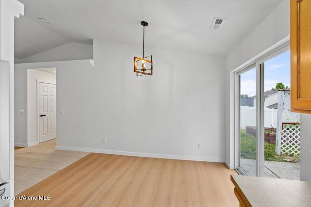 1374 W Timor Ave, Coeur Dalene, ID 83815 - unfurnished dining area with light wood-type flooring, a chandelier, vaulted ceiling, and baseboards
