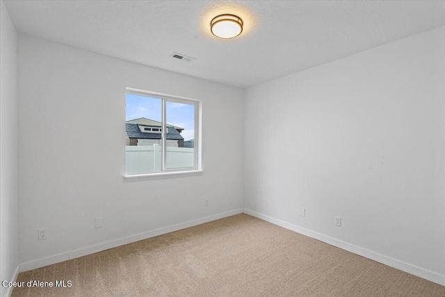 1374 W Timor Ave, Coeur Dalene, ID 83815 - spare room with carpet floors and baseboards