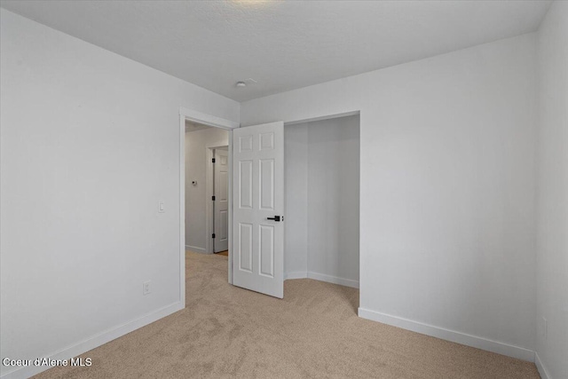 1374 W Timor Ave, Coeur Dalene, ID 83815 - unfurnished room featuring light carpet and baseboards