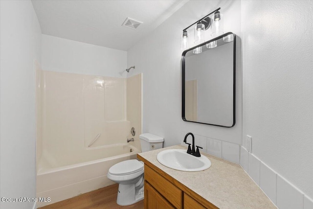 1374 W Timor Ave, Coeur Dalene, ID 83815 - bathroom featuring toilet, vanity, shower / tub combination, and wood finished floors