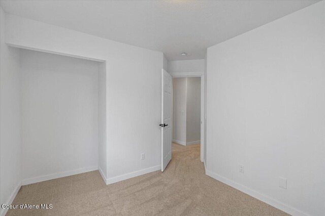 1374 W Timor Ave, Coeur Dalene, ID 83815 - spare room featuring carpet floors and baseboards