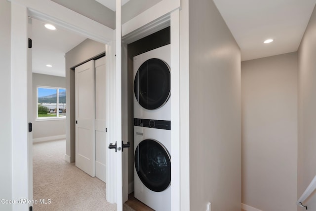 1682 Onyx Ct 1670, 1674 1678, Sandpoint, ID 83864 - laundry area with stacked washer / dryer, light colored carpet, baseboards, and recessed lighting