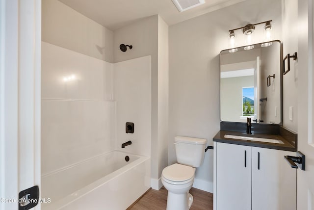 1682 Onyx Ct 1670, 1674 1678, Sandpoint, ID 83864 - bathroom featuring toilet, bathing tub / shower combination, vanity, wood finished floors, and baseboards