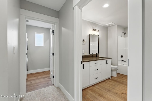 1682 Onyx Ct 1670, 1674 1678, Sandpoint, ID 83864 - full bath featuring vanity, toilet, shower / bathtub combination, baseboards, and wood finished floors