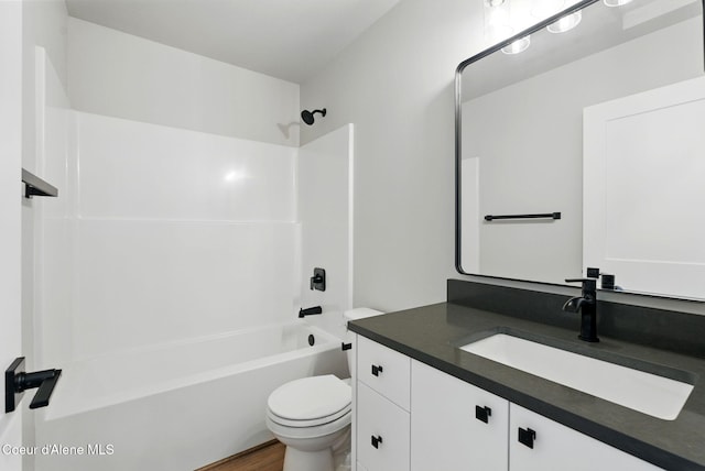 1682 Onyx Ct 1670, 1674 1678, Sandpoint, ID 83864 - full bath with vanity, toilet, washtub / shower combination, and wood finished floors