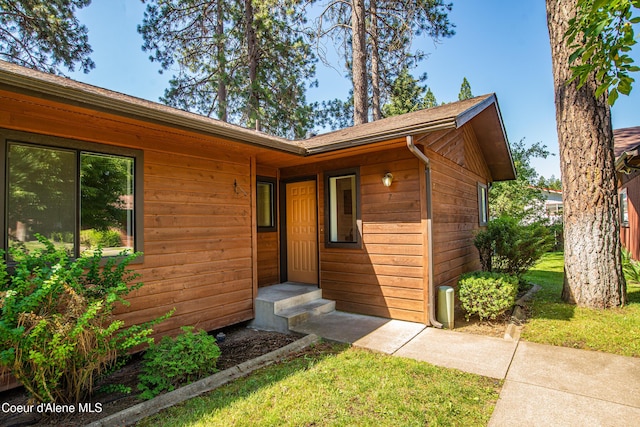 1130 E Timber Ln # 7, Coeur Dalene, ID 83815 - view of exterior entry featuring a lawn
