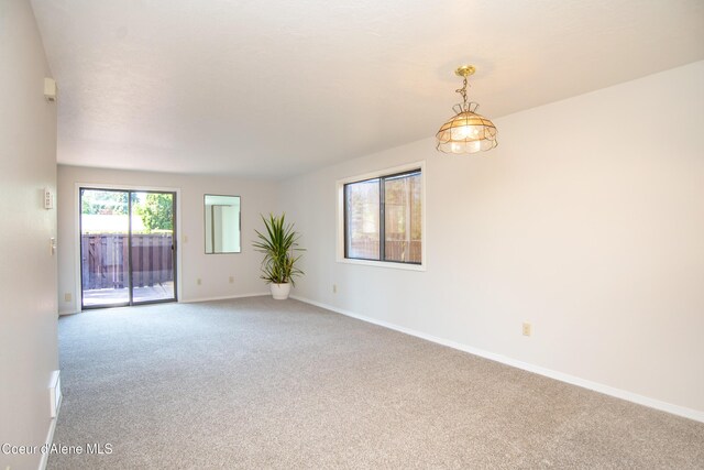 1130 E Timber Ln # 7, Coeur Dalene, ID 83815 - spare room with carpet floors and baseboards