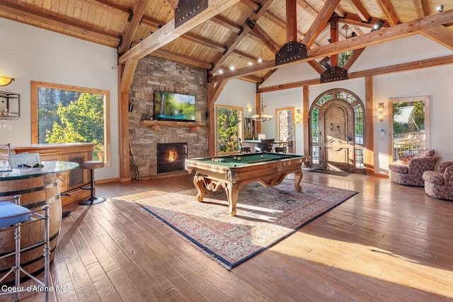 14318 N Waters Edge Ct, Hayden, ID 83835 - recreation room with a stone fireplace, wooden ceiling with exposed beams, billiards table, high vaulted ceiling, and healthy amount of natural light