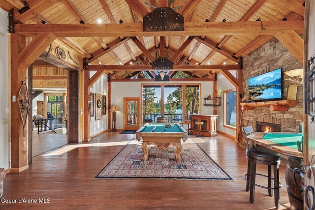 14318 N Waters Edge Ct, Hayden, ID 83835 - rec room featuring baseboards, billiards table, plenty of natural light, high vaulted ceiling, and wood ceiling with exposed beams