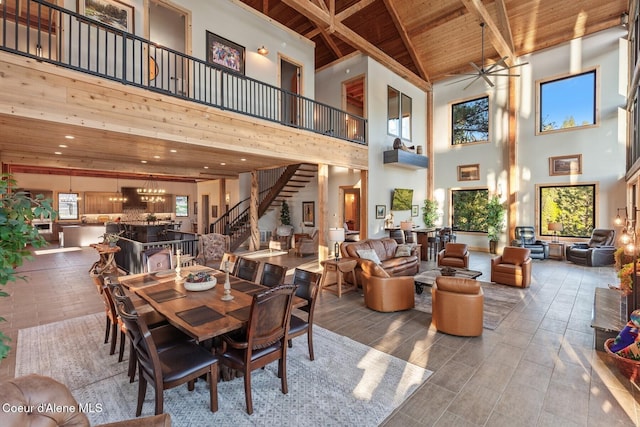 14318 N Waters Edge Ct, Hayden, ID 83835 - dining space featuring wood ceiling with exposed beams, high vaulted ceiling, stairway, and ceiling fan