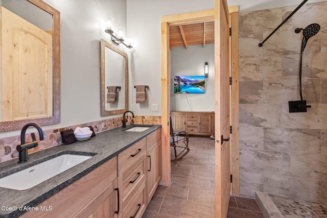 14318 N Waters Edge Ct, Hayden, ID 83835 - full bath with tiled shower, double vanity, and beamed ceiling