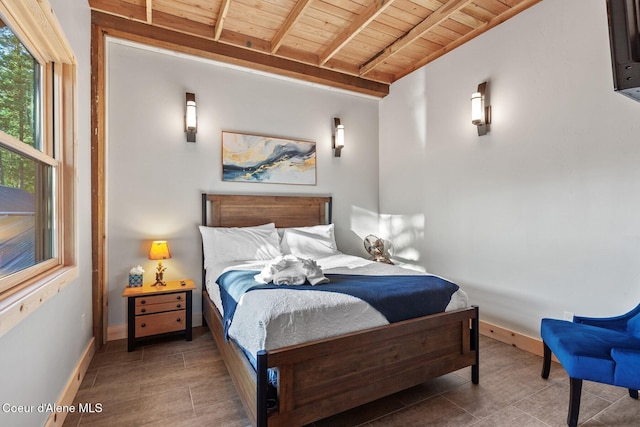 14318 N Waters Edge Ct, Hayden, ID 83835 - bedroom featuring wooden ceiling with exposed beams and baseboards