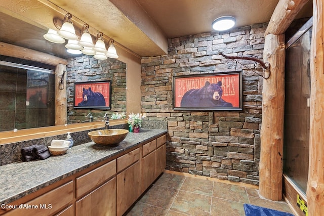 14318 N Waters Edge Ct, Hayden, ID 83835 - bathroom with vanity and stone finish floors