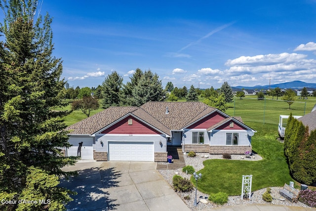 3025 N Sand Trap Way, Post Falls, ID 83854 - view of front facade featuring driveway, an attached garage, a front lawn, and a mountain view