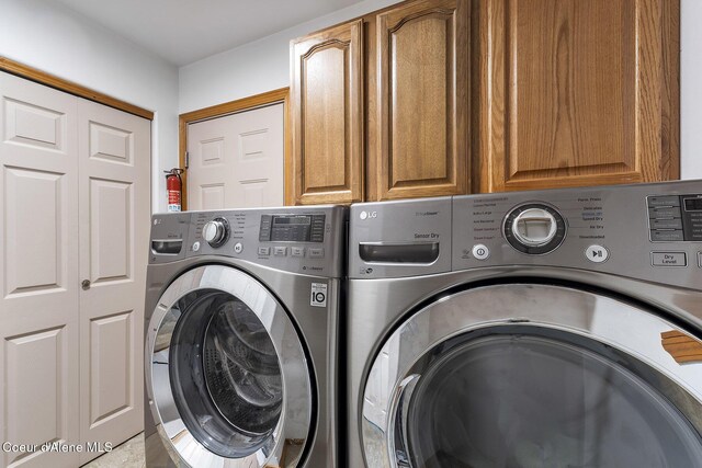 3025 N Sand Trap Way, Post Falls, ID 83854 - laundry room with washing machine and dryer and cabinet space