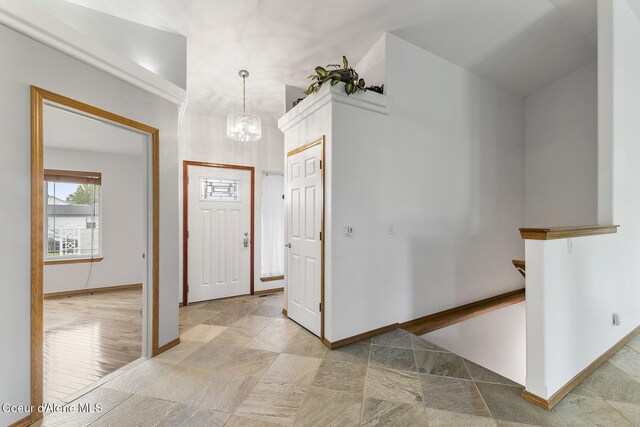 3025 N Sand Trap Way, Post Falls, ID 83854 - foyer entrance with a chandelier and baseboards