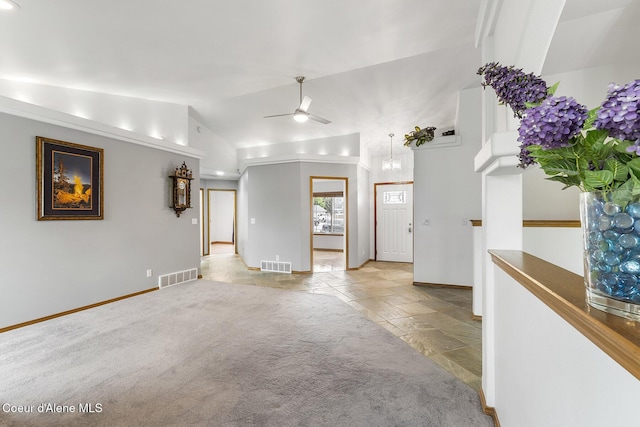 3025 N Sand Trap Way, Post Falls, ID 83854 - unfurnished living room featuring vaulted ceiling, stone tile flooring, baseboards, and a ceiling fan