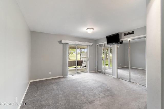 3025 N Sand Trap Way, Post Falls, ID 83854 - unfurnished bedroom with access to exterior, carpet flooring, and baseboards