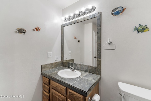 3025 N Sand Trap Way, Post Falls, ID 83854 - bathroom with vanity and toilet