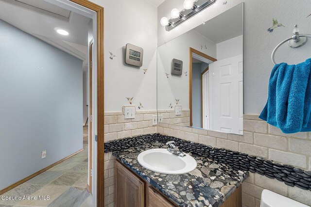 3025 N Sand Trap Way, Post Falls, ID 83854 - half bathroom featuring vanity and toilet