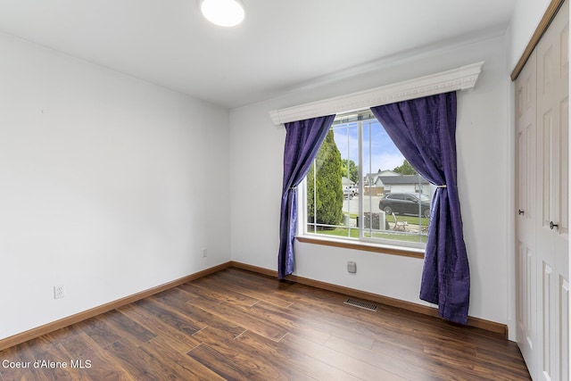 3025 N Sand Trap Way, Post Falls, ID 83854 - spare room with dark wood-style floors and baseboards
