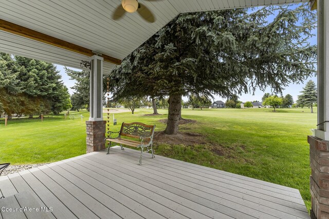 3025 N Sand Trap Way, Post Falls, ID 83854 - wooden terrace with ceiling fan and a yard