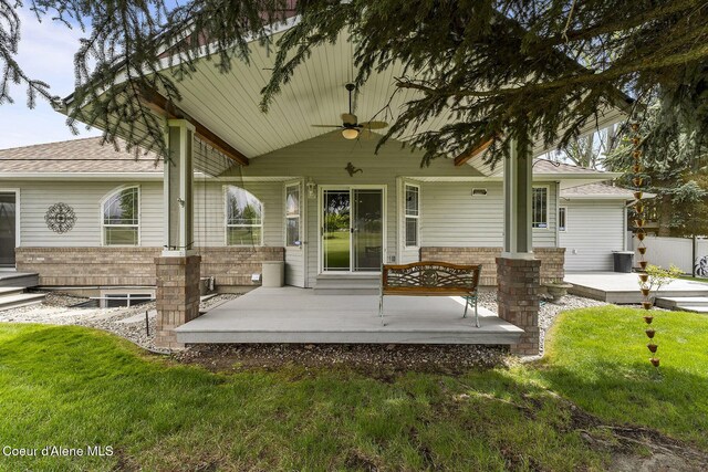 3025 N Sand Trap Way, Post Falls, ID 83854 - covered porch featuring ceiling fan and a lawn