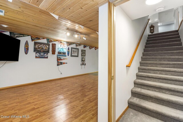 3025 N Sand Trap Way, Post Falls, ID 83854 - stairs with wooden ceiling, baseboards, and wood finished floors