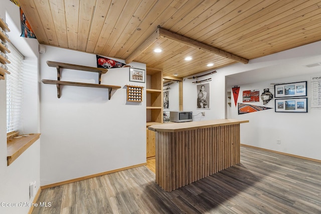 3025 N Sand Trap Way, Post Falls, ID 83854 - indoor dry bar with light wood-type flooring, recessed lighting, baseboards, stainless steel microwave, and wood ceiling with exposed beams