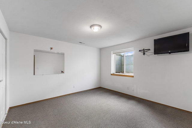 3025 N Sand Trap Way, Post Falls, ID 83854 - carpeted empty room with baseboards