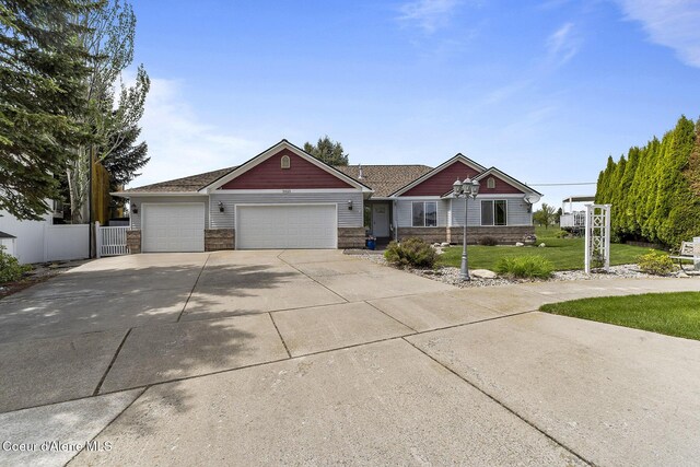 3025 N Sand Trap Way, Post Falls, ID 83854 - craftsman house with a garage and driveway