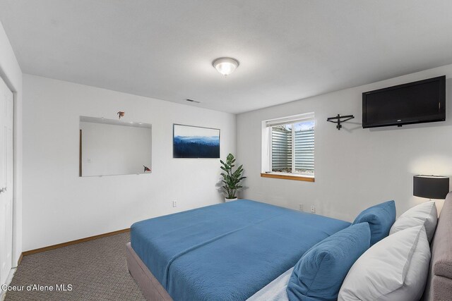 3025 N Sand Trap Way, Post Falls, ID 83854 - carpeted bedroom featuring baseboards