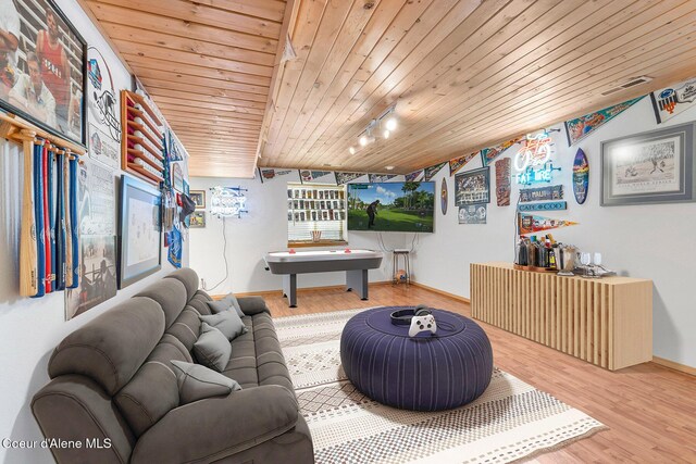 3025 N Sand Trap Way, Post Falls, ID 83854 - living room featuring wooden ceiling, wood finished floors, baseboards, and rail lighting