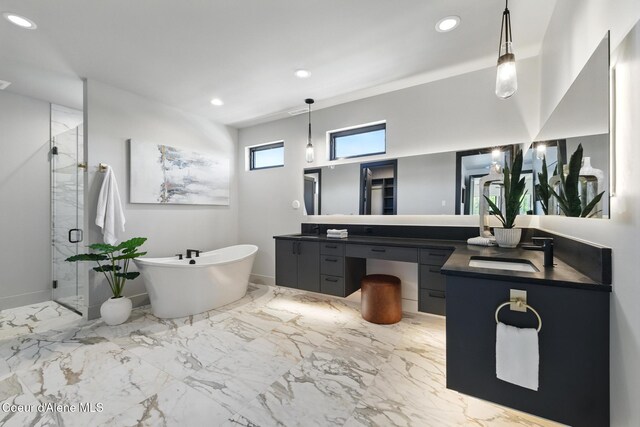 2888 W Lumber Ln, Coeur Dalene, ID 83814 - bathroom featuring vanity, a marble finish shower, a soaking tub, recessed lighting, and marble tiled flooring