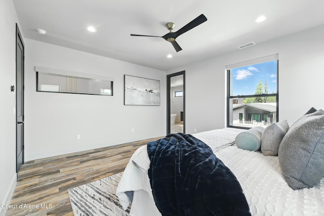 2888 W Lumber Ln, Coeur Dalene, ID 83814 - bedroom featuring wood finished floors, recessed lighting, ensuite bathroom, and a ceiling fan