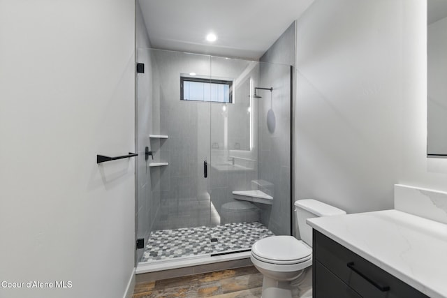 2888 W Lumber Ln, Coeur Dalene, ID 83814 - full bathroom featuring toilet, vanity, a stall shower, and recessed lighting