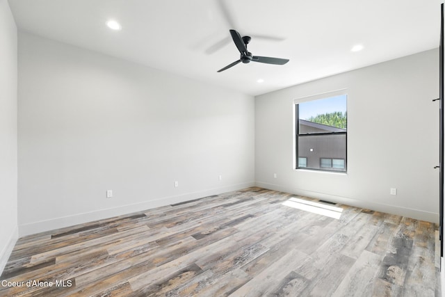 2888 W Lumber Ln, Coeur Dalene, ID 83814 - empty room featuring wood finished floors, a ceiling fan, recessed lighting, and baseboards
