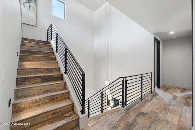 2888 W Lumber Ln, Coeur Dalene, ID 83814 - staircase featuring wood finished floors, baseboards, and recessed lighting