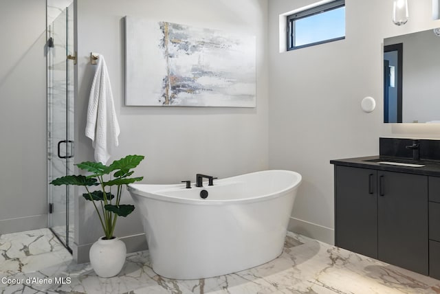 2888 W Lumber Ln, Coeur Dalene, ID 83814 - full bathroom featuring vanity, marble tiled flooring, a freestanding tub, and a shower stall
