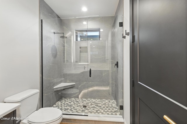 2888 W Lumber Ln, Coeur Dalene, ID 83814 - bathroom featuring toilet, vanity, and a stall shower