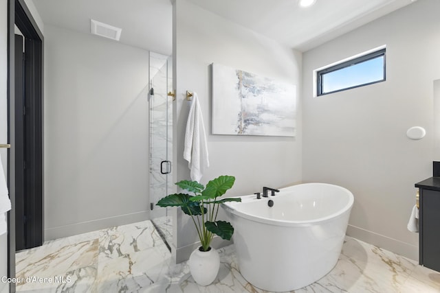 2888 W Lumber Ln, Coeur Dalene, ID 83814 - bathroom with a freestanding tub, a stall shower, marble finish flooring, vanity, and baseboards