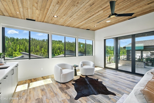 2888 W Lumber Ln, Coeur Dalene, ID 83814 - living area with wood ceiling, recessed lighting, a ceiling fan, light wood-style floors, and baseboards