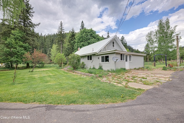 59A Creek Side Dr, Wallace, ID 83873 - view of side of property featuring a lawn and metal roof
