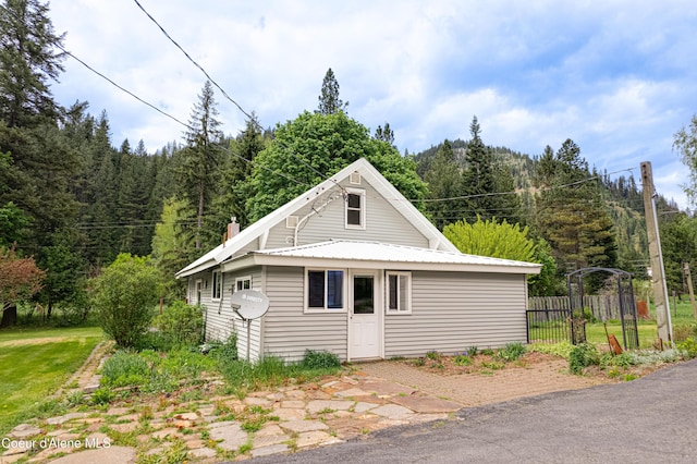 59A Creek Side Dr, Wallace, ID 83873 - view of home's exterior featuring a forest view and metal roof