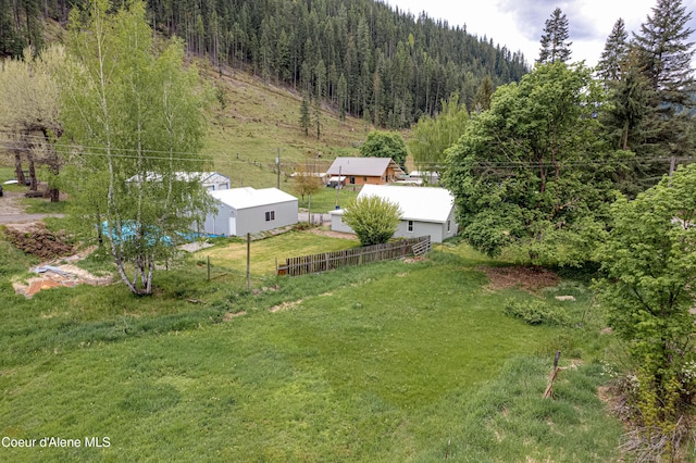 59A Creek Side Dr, Wallace, ID 83873 - view of yard with a wooded view and an outbuilding